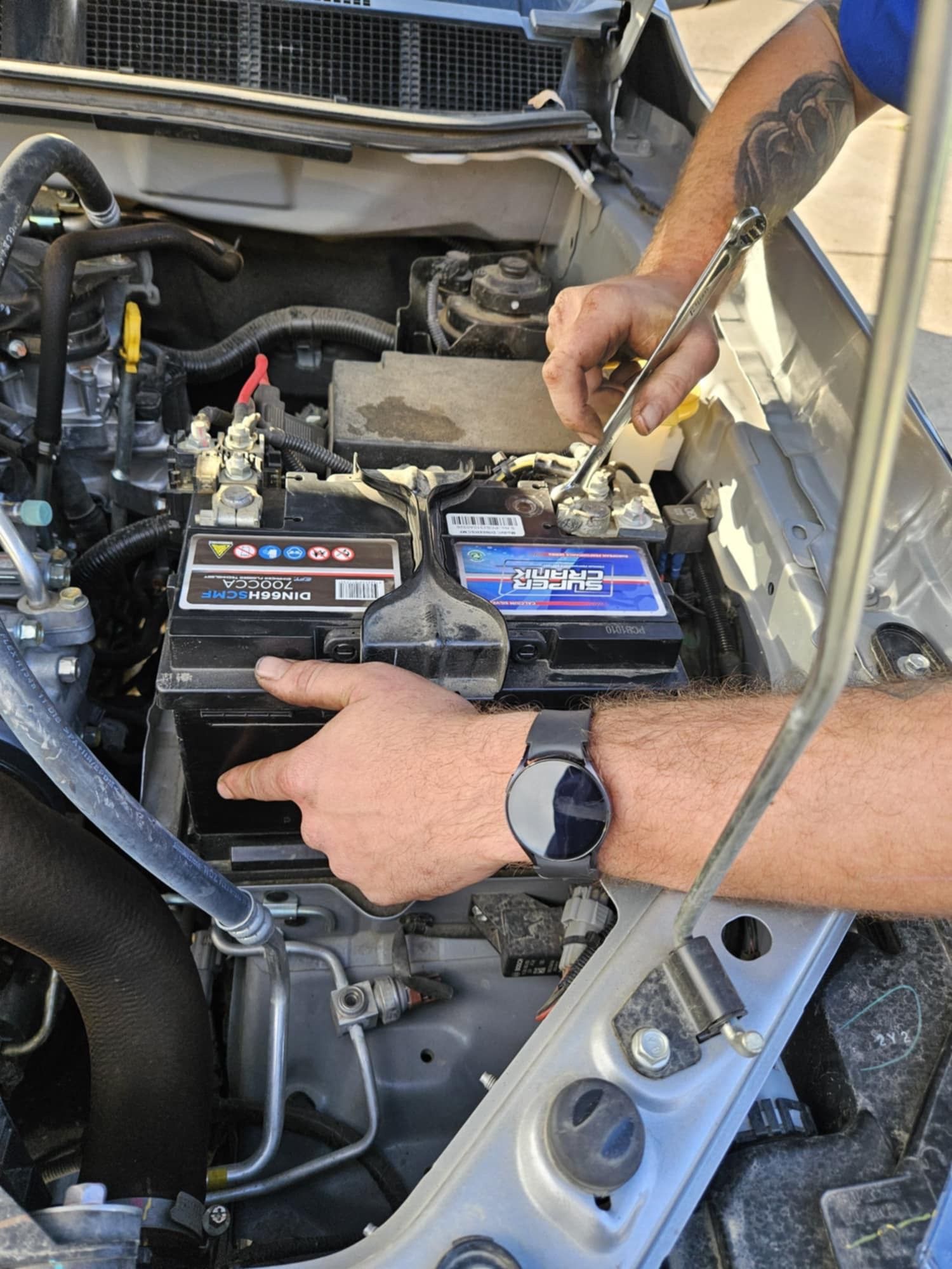 A Man Is Working On A Boat Engine In A Factory — SRG Automotive and Marine in Aitkenvale, QLD