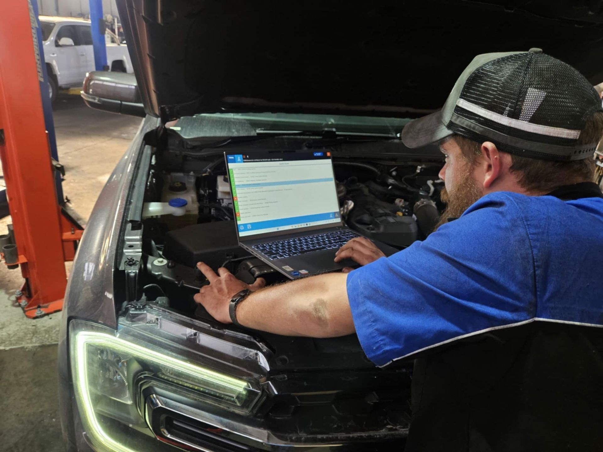 A Semi Truck Is Driving Down A Highway At Sunset — SRG Automotive and Marine in Aitkenvale, QLD