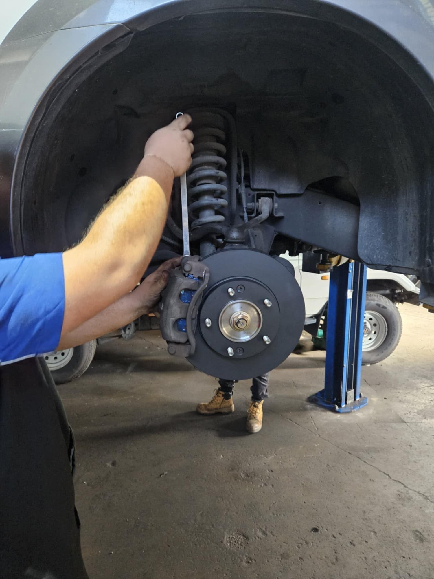 A Jeep Is Driving Through A Muddy Puddle — SRG Automotive and Marine in Aitkenvale, QLD