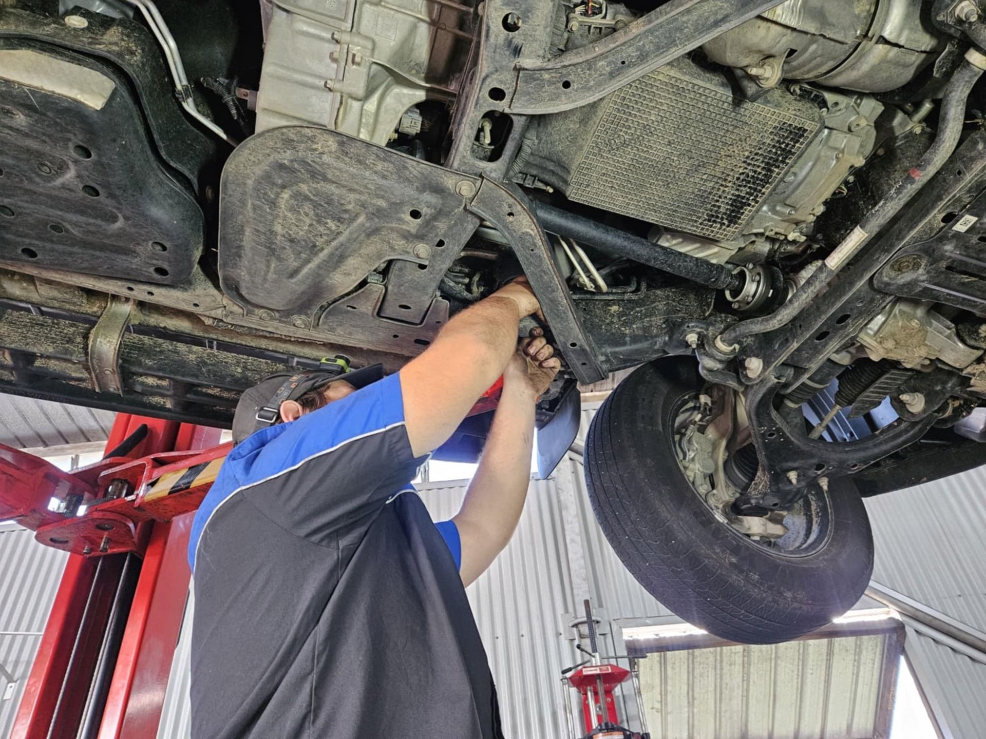A Close Up Of A Car Engine With A Red Battery — SRG Automotive and Marine in Aitkenvale, QLD