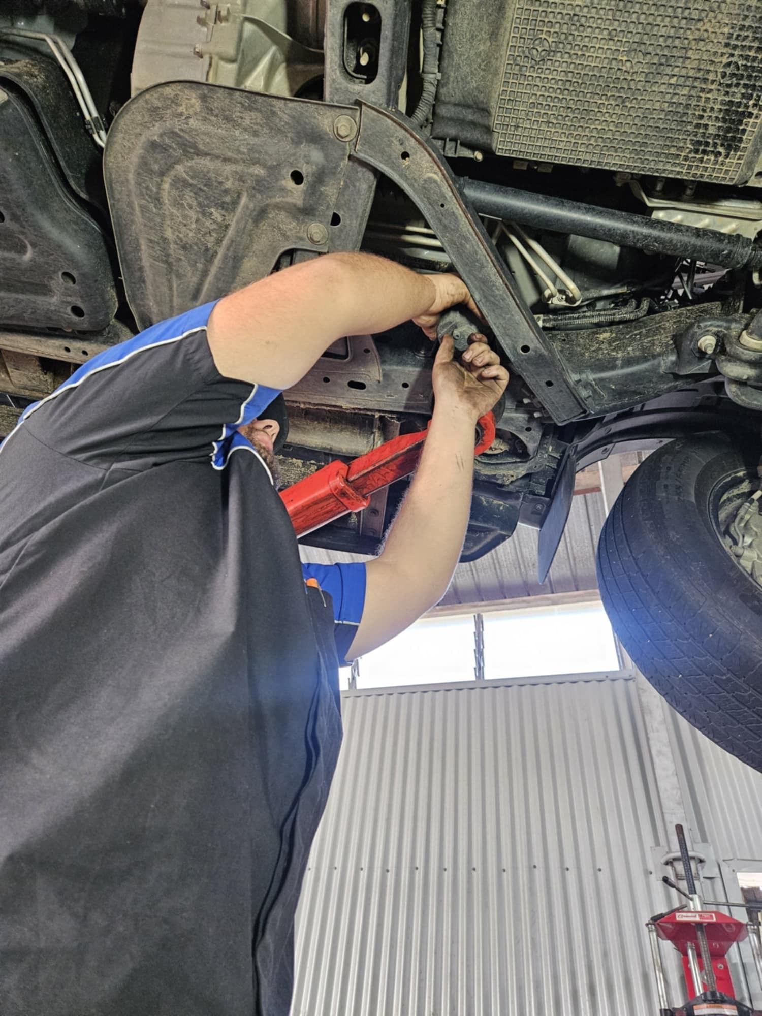 A Row Of White Trucks Are Parked In Front Of A Building — SRG Automotive and Marine in Aitkenvale, QLD