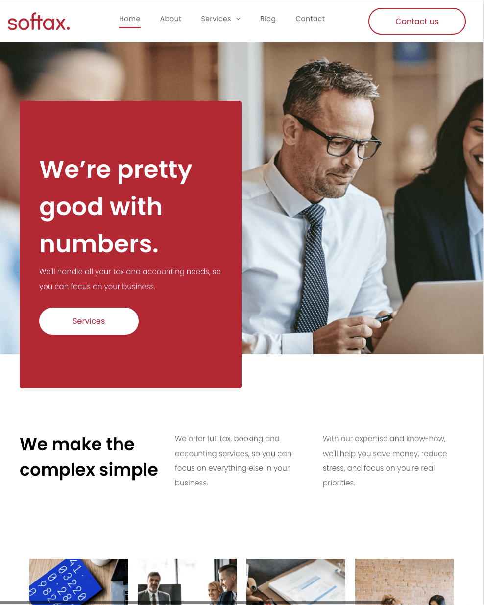 A man in a suit and tie is sitting in front of a laptop computer.