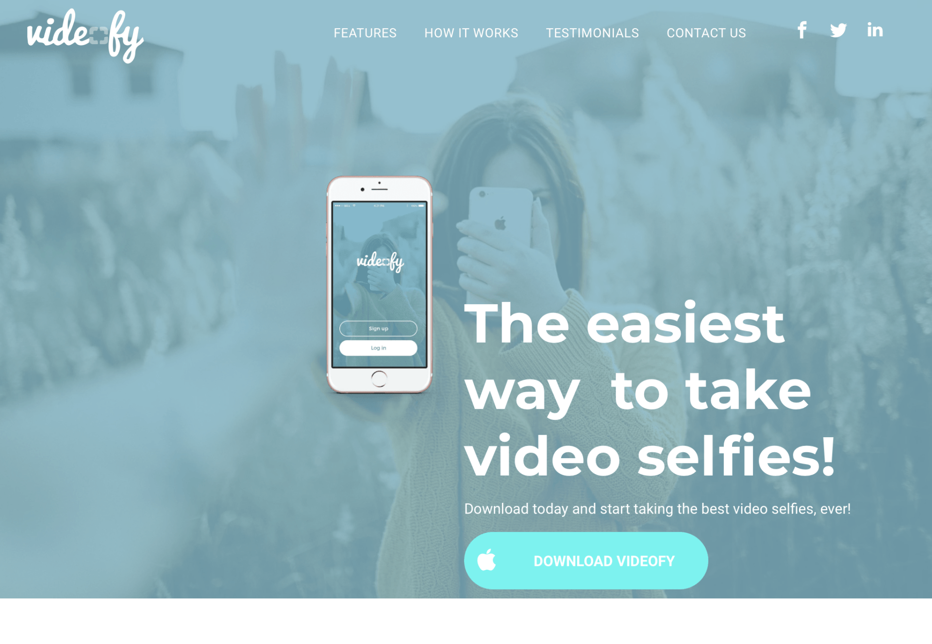 A woman is taking a selfie with a cell phone.