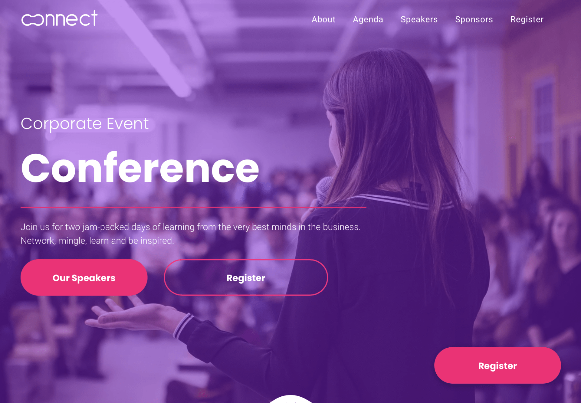 A woman is giving a speech in front of a crowd at a conference.