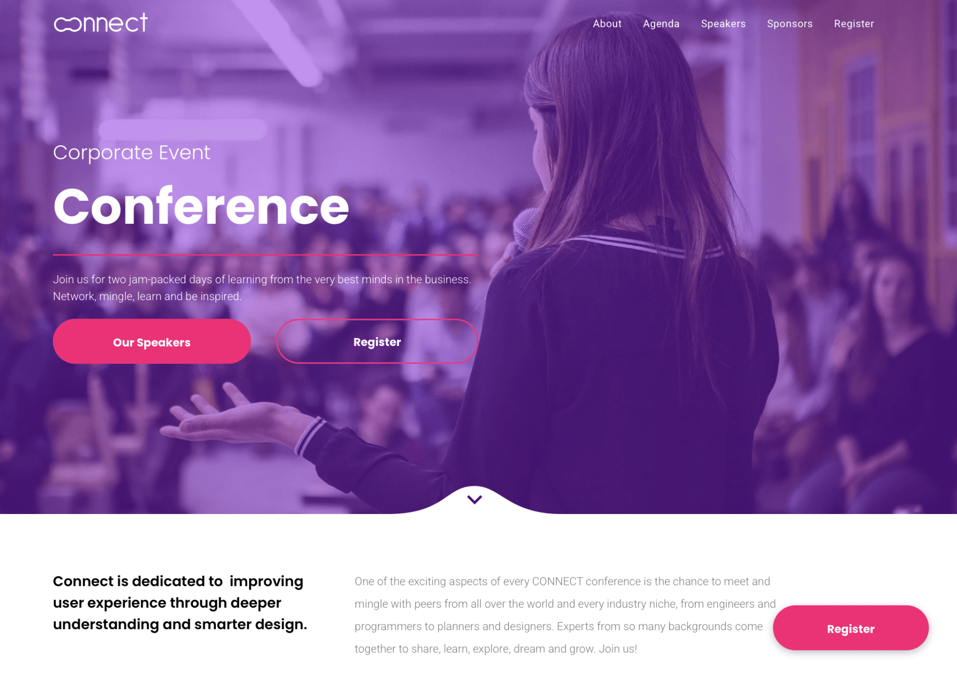 A woman is giving a presentation in front of a crowd at a conference.