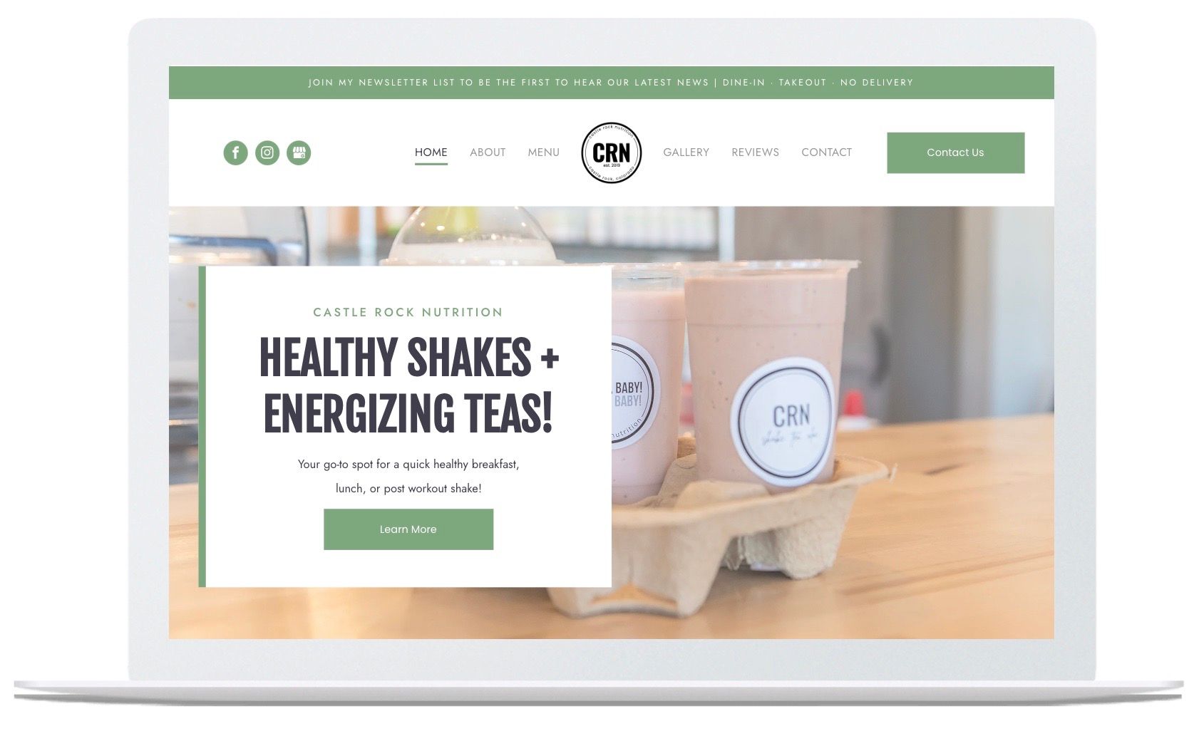 A laptop screen shows a website for healthy shakes and energizing teas.