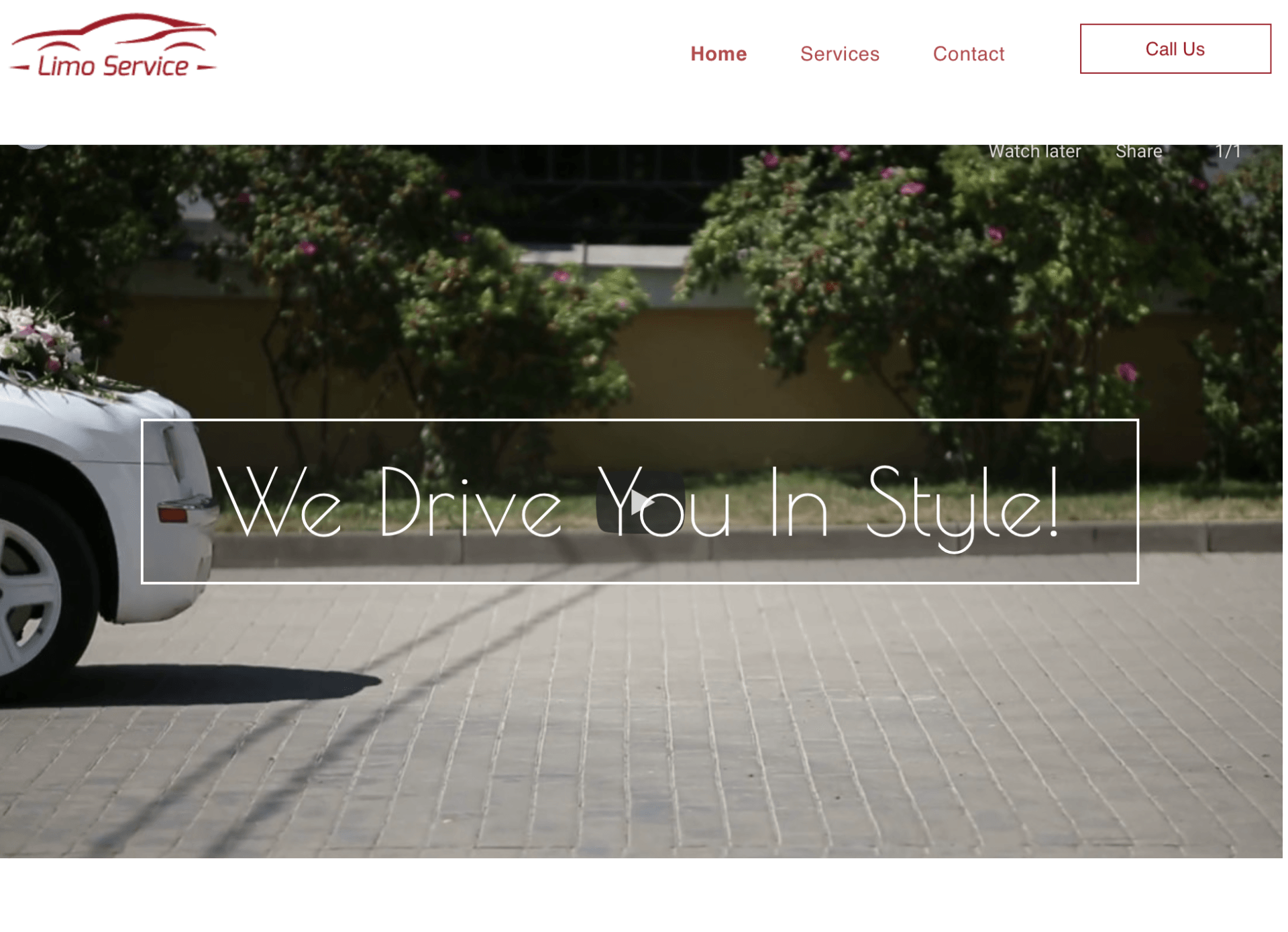 A white car is parked on the side of the road.