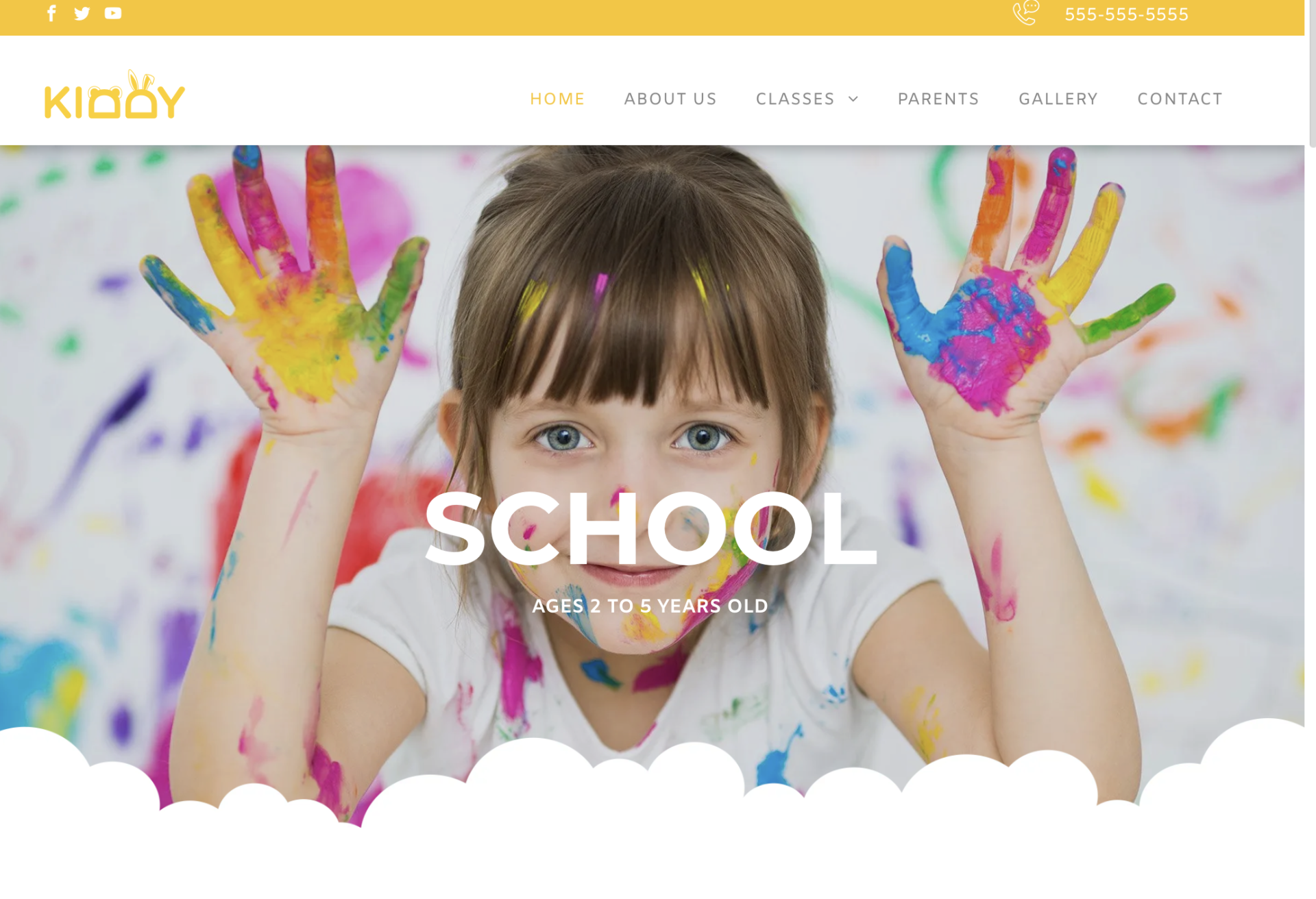 A little girl with her hands painted in different colors is on the school website.