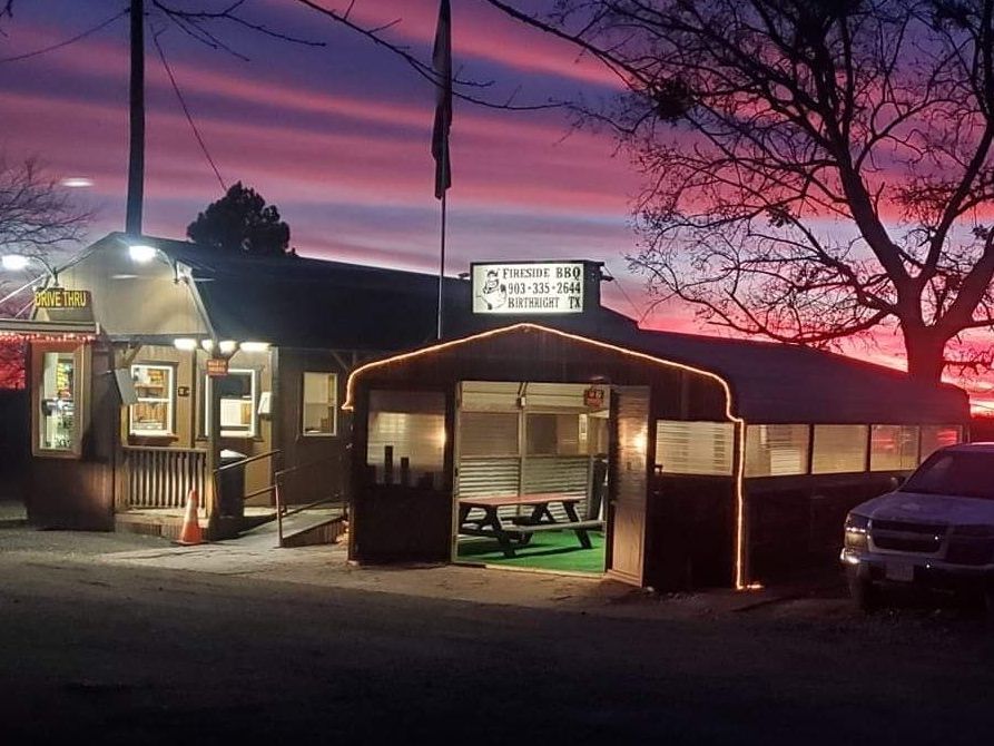 A store front with a sign that says ' ice cream hut ' on it