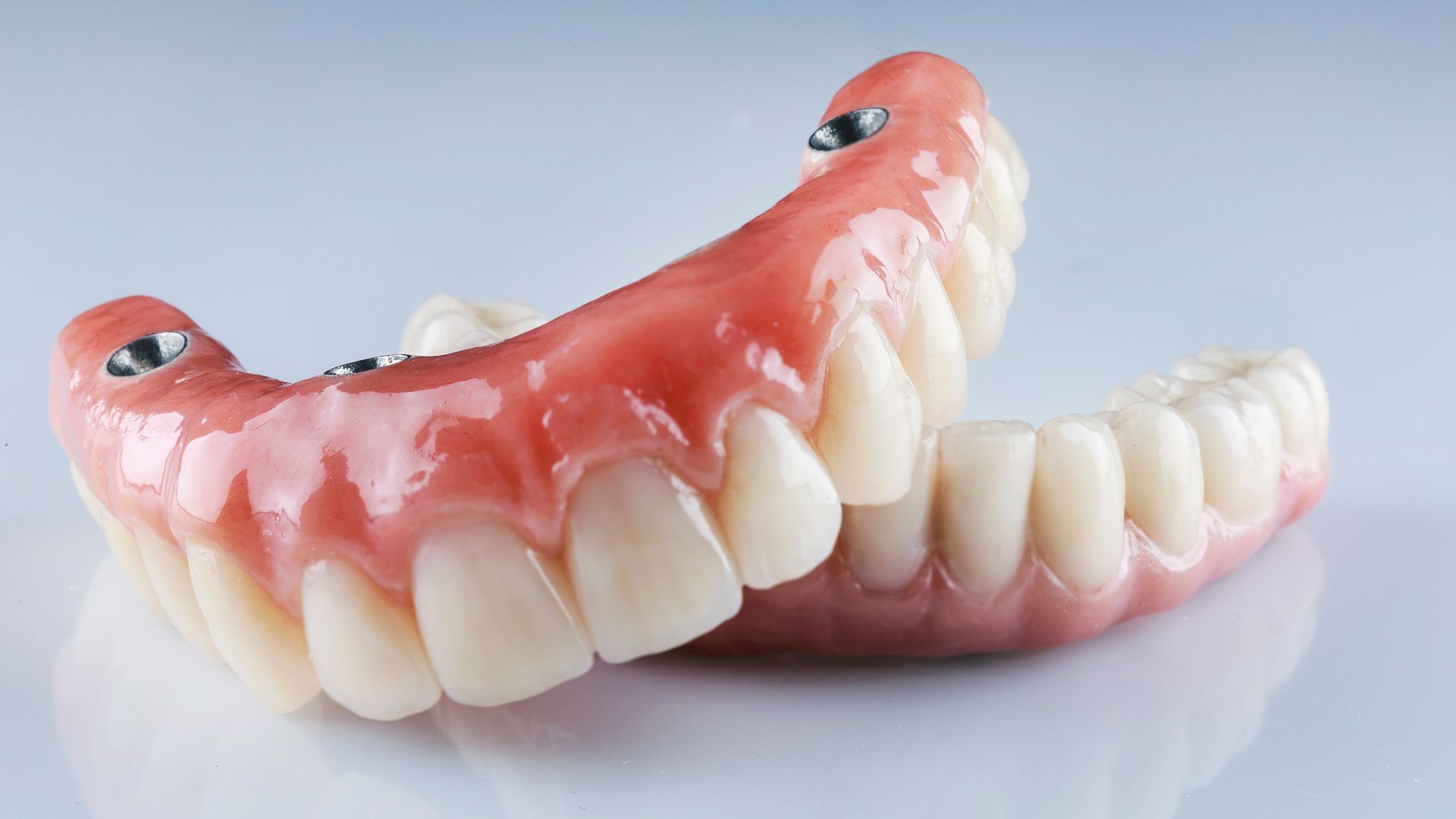 A close up of a denture on a table.