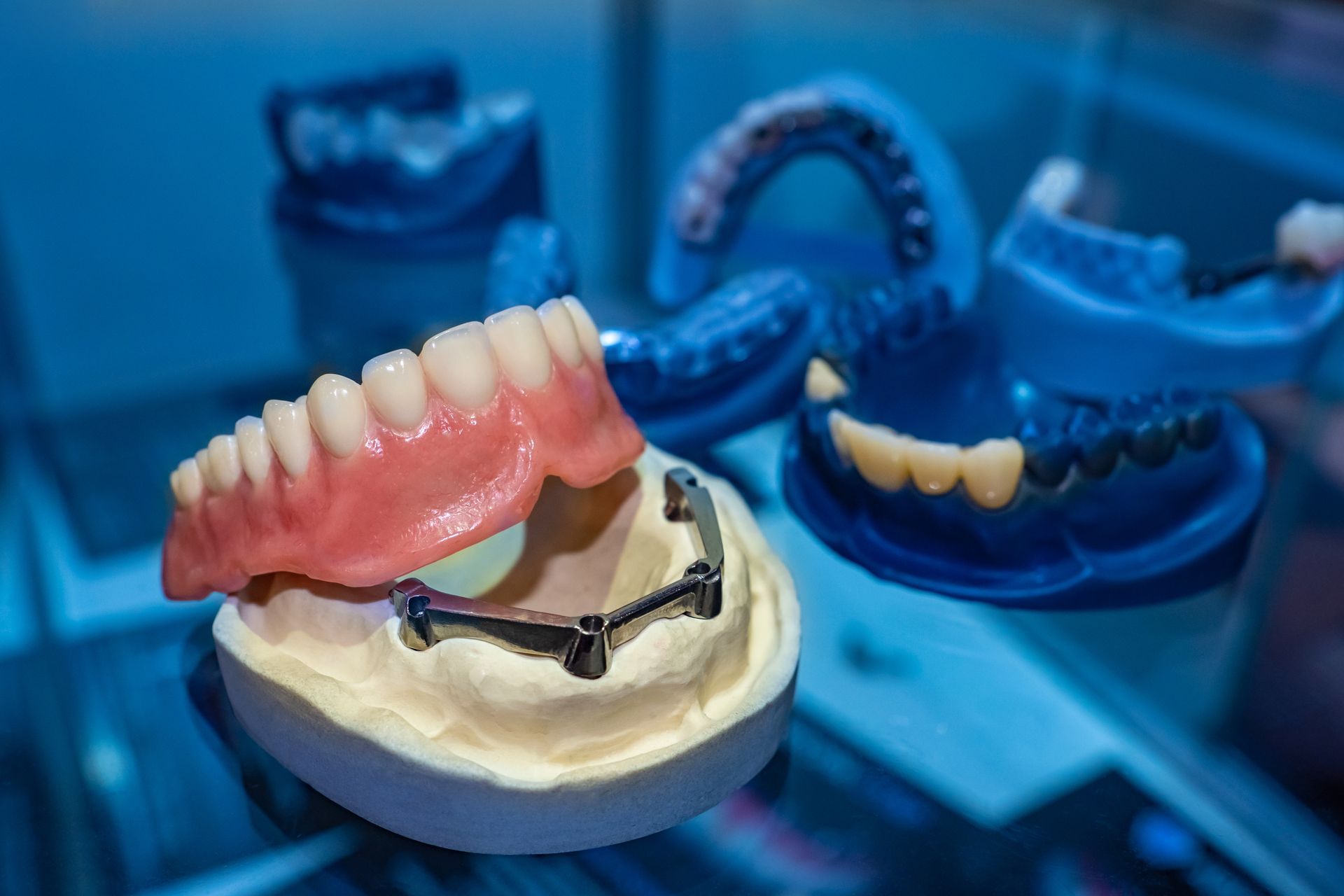 There are many different types of dentures on the table.