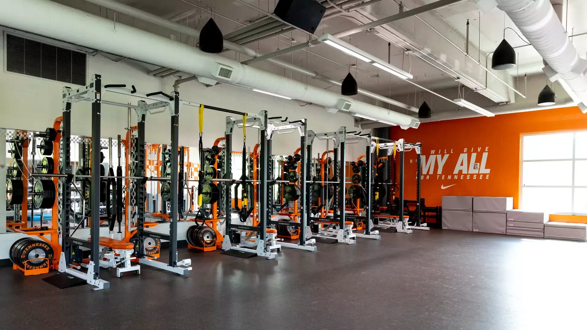 A gym with a sign on the wall that says `` my all ''