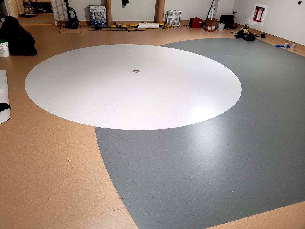 There is a circle in the middle of the floor.
