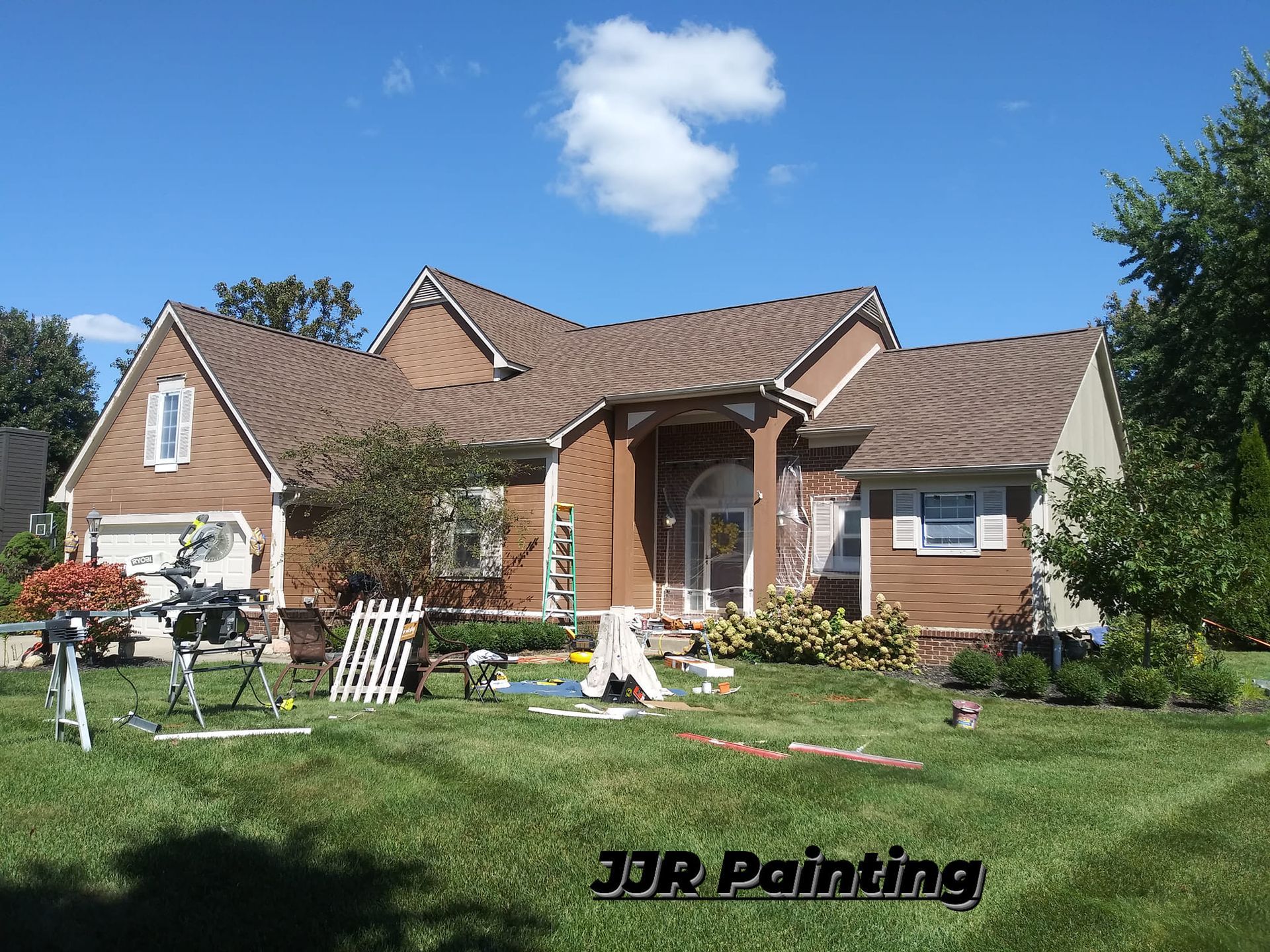 A house that is being painted by jr painting
