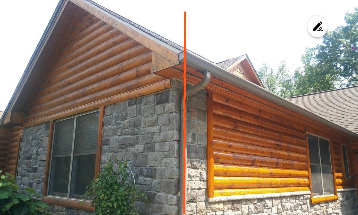 A log cabin with a gutter on the side of it
