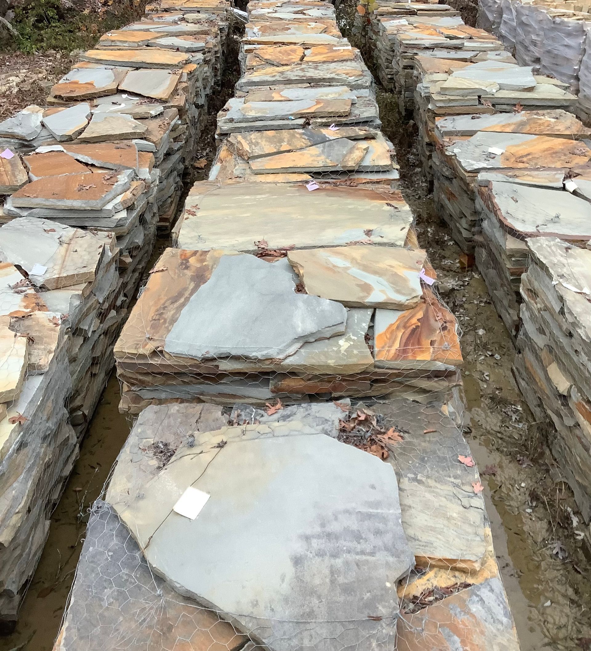A row of rocks stacked on top of each other in a pile.