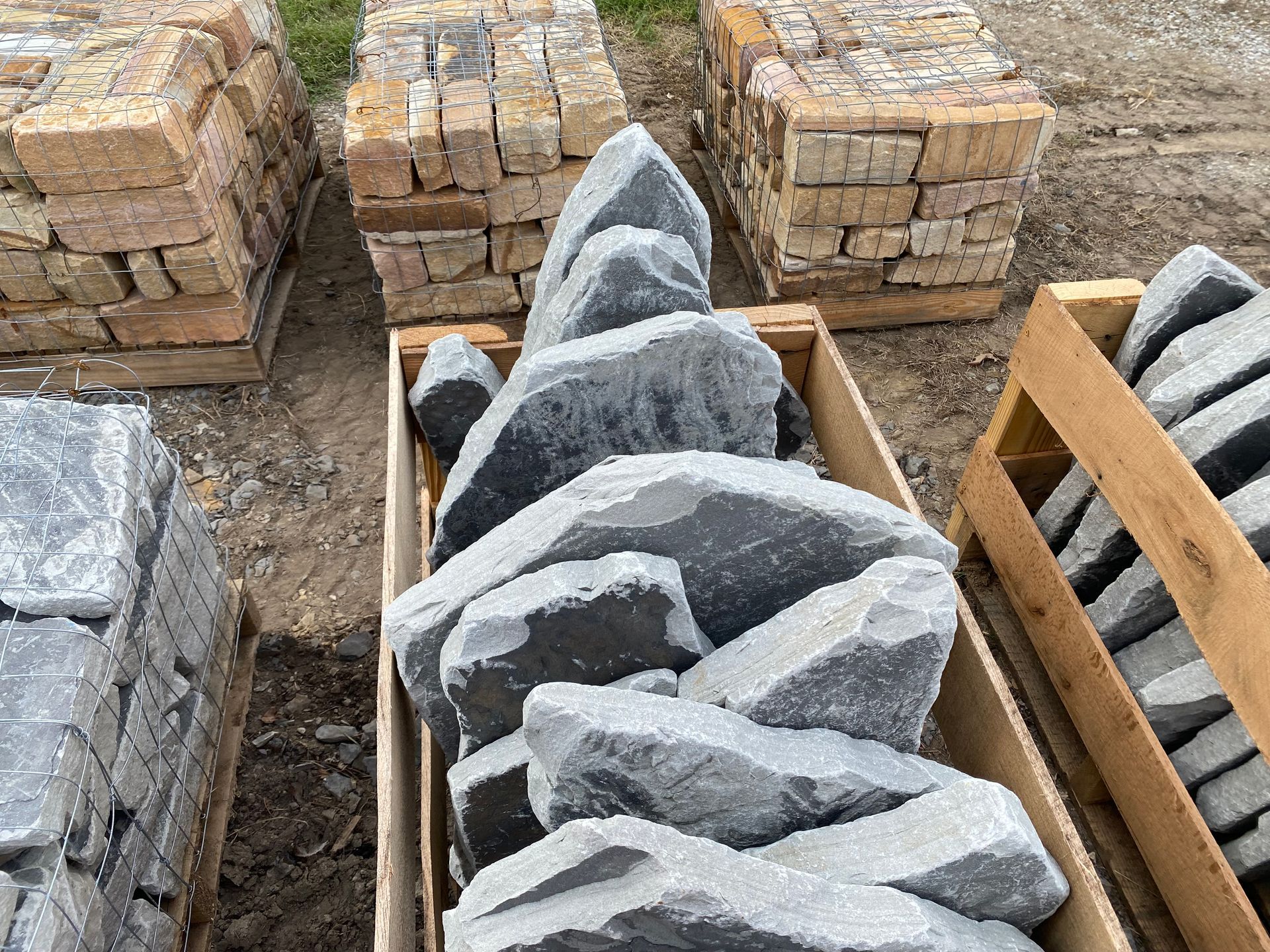 A pile of rocks is sitting in a wooden box.