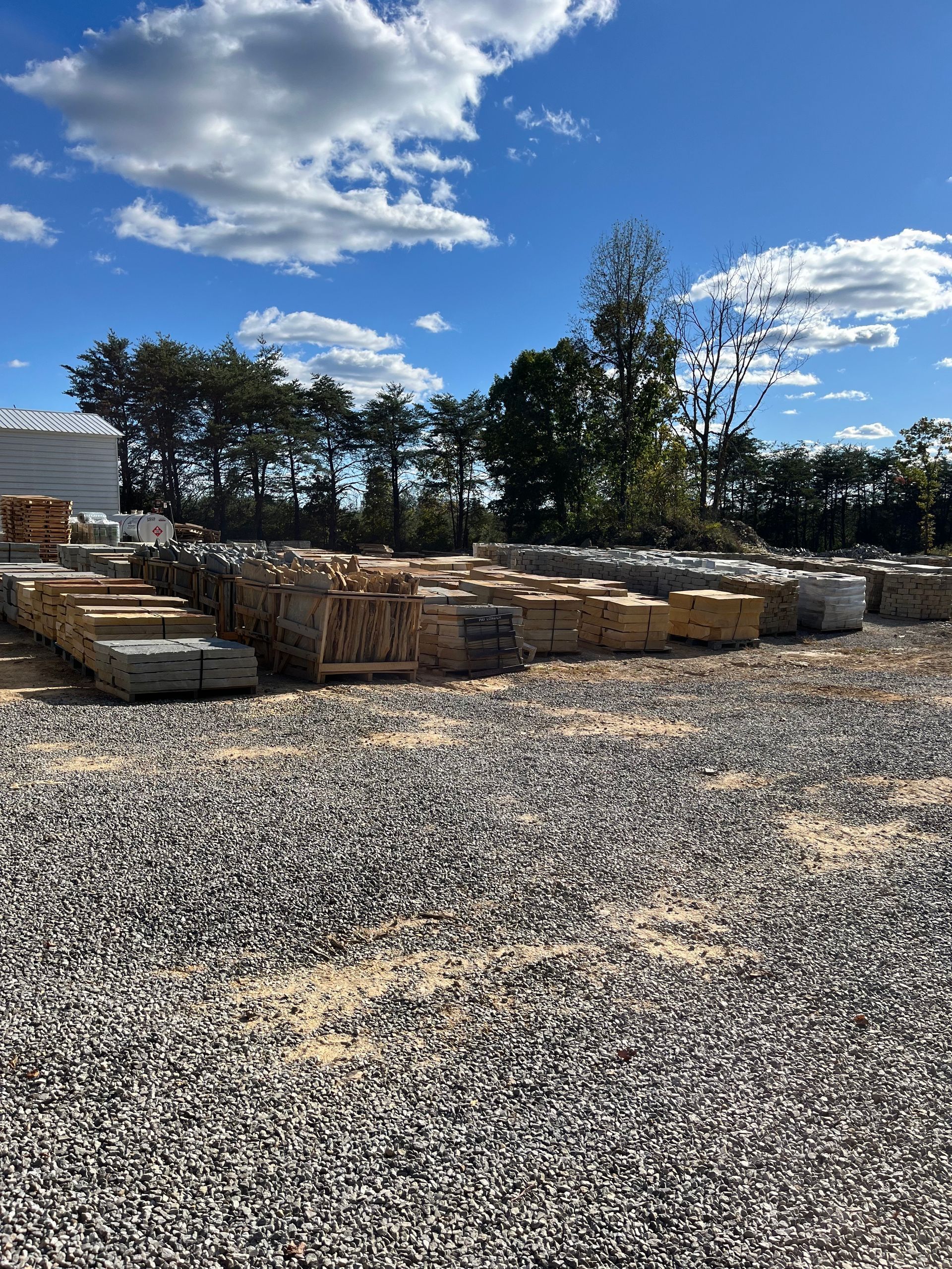 A pile of concrete blocks sitting on top of a gravel field.