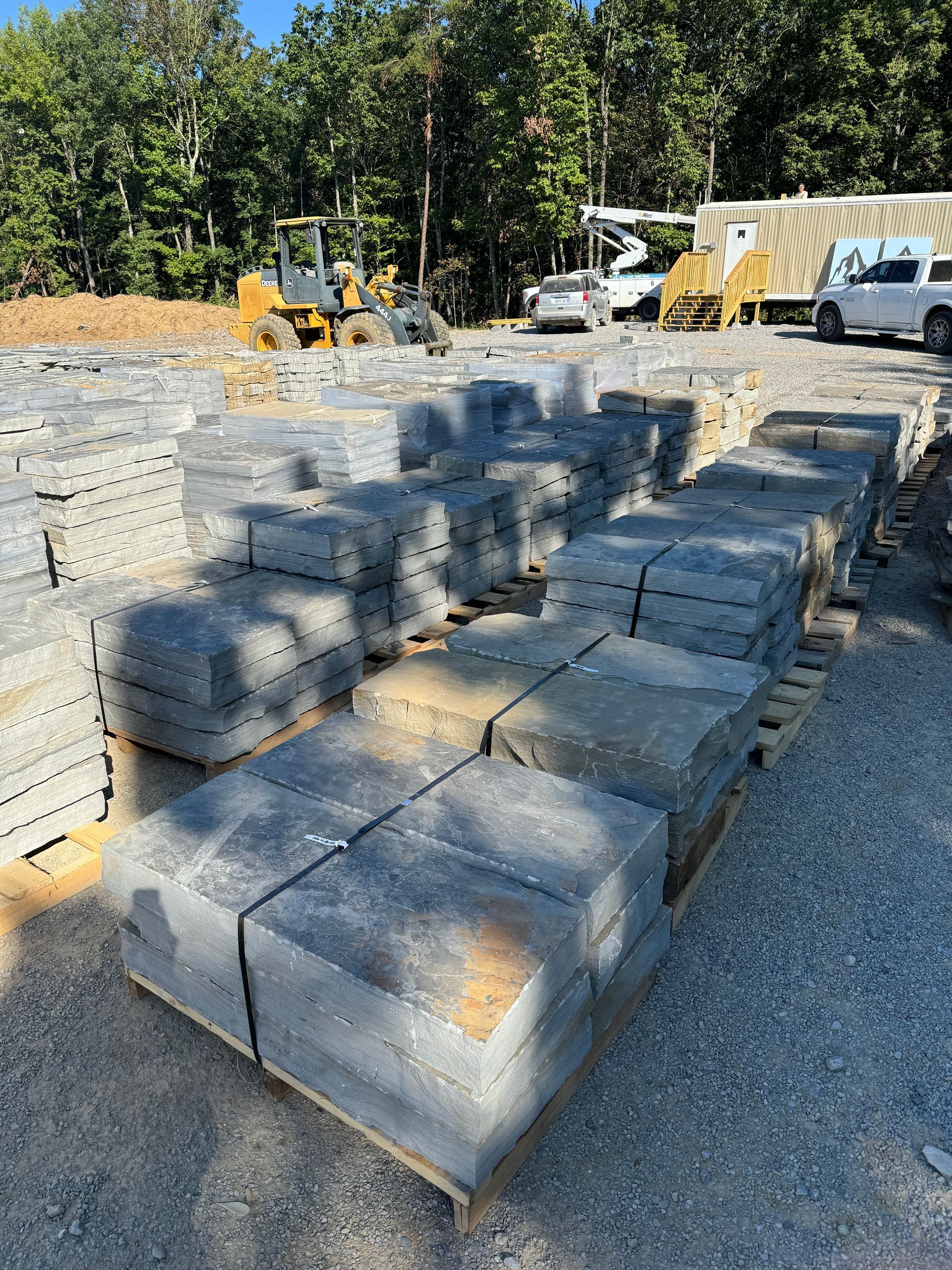 A pile of concrete blocks sitting on top of a wooden pallet.