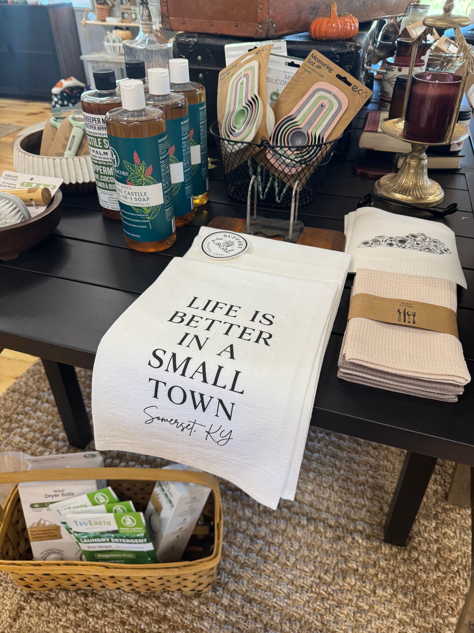 An open sign is hanging on a wooden door.