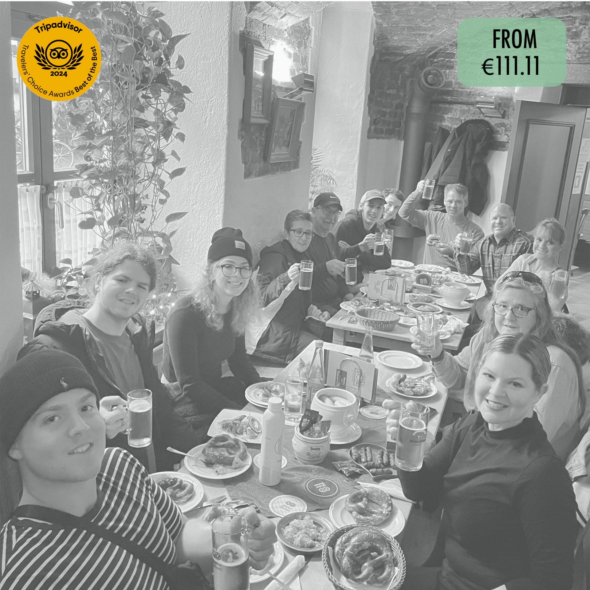 A group of people are sitting at a table eating food.