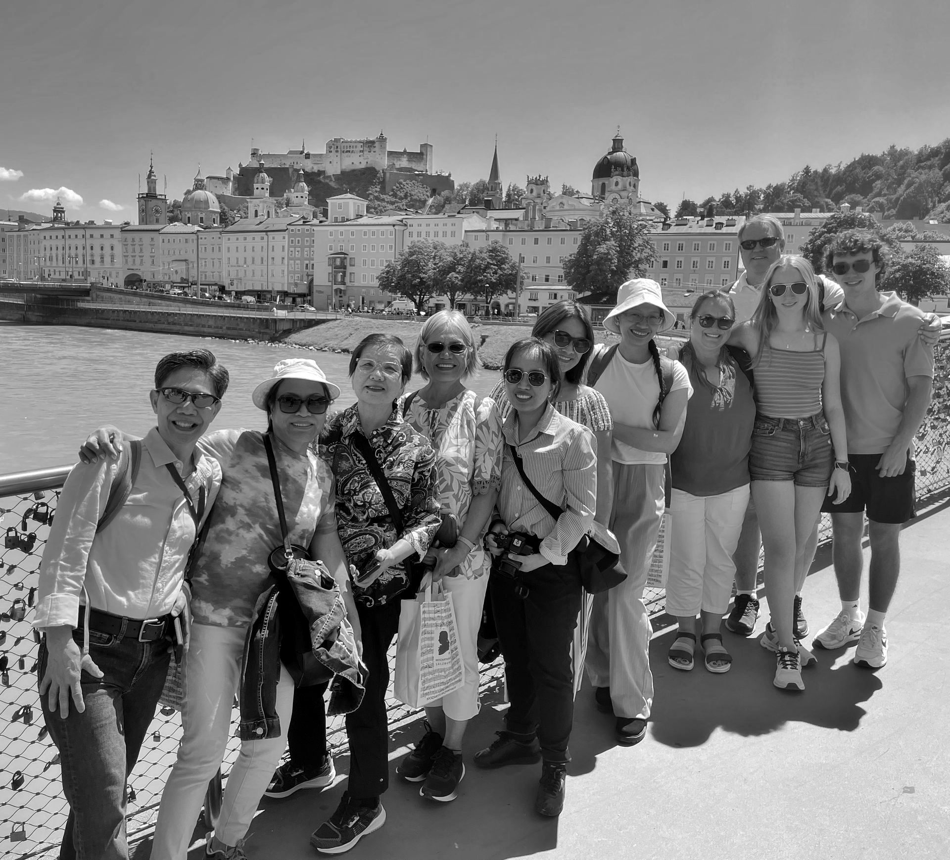 A black and white photo of a group of people posing for a picture