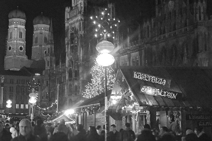 A black and white photo of a christmas market
