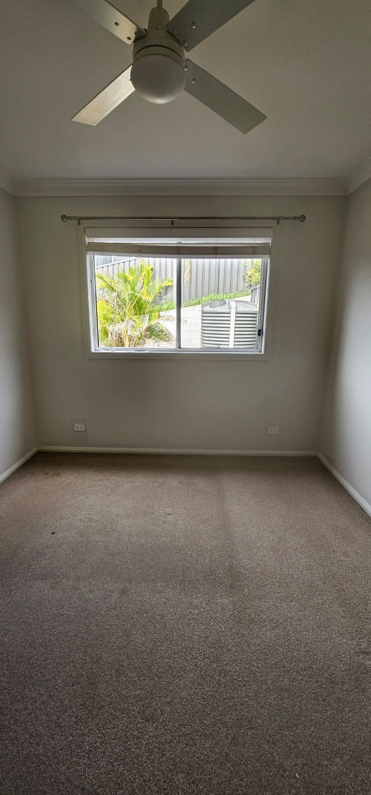 An empty room with a window.