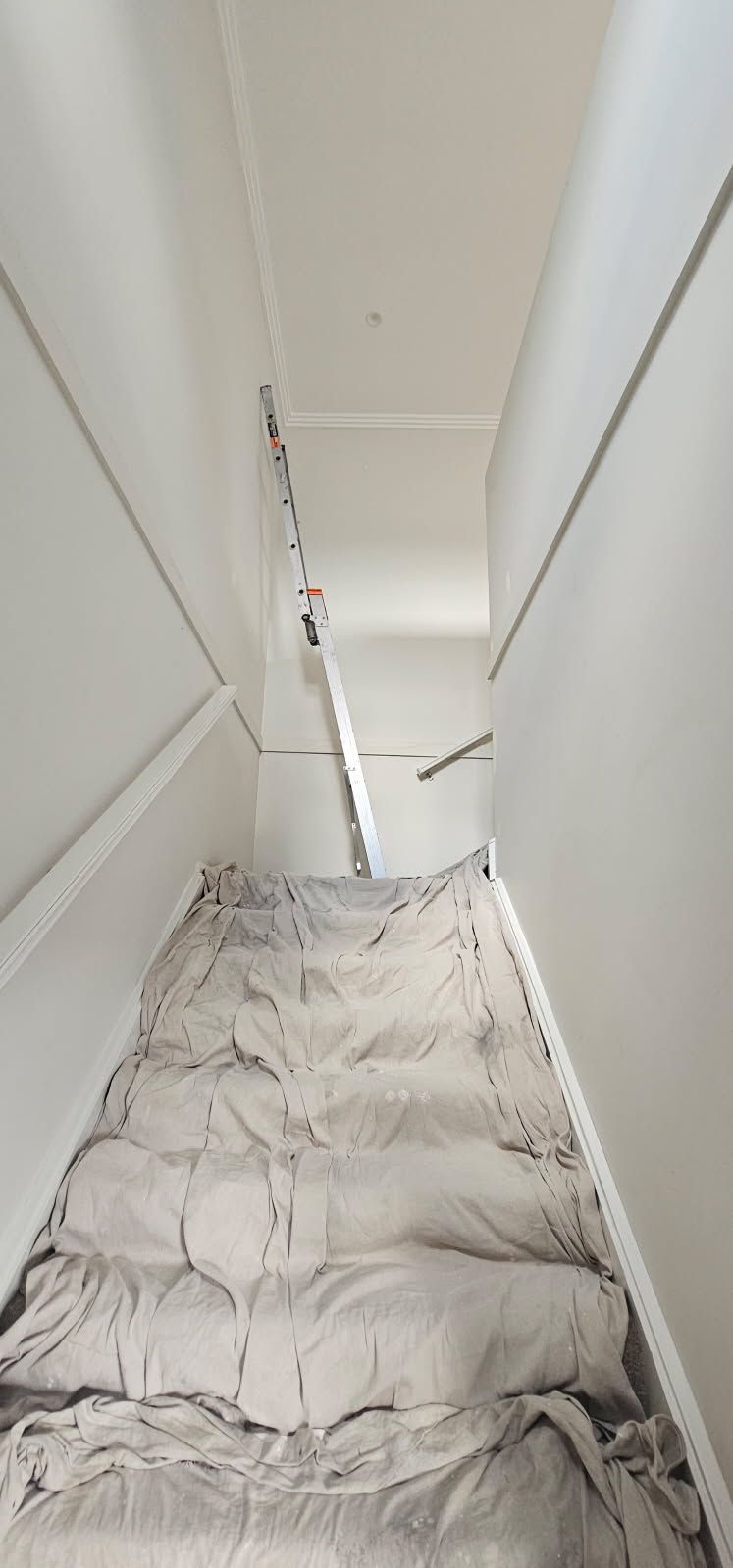 A picture of a staircase covered in white paint.