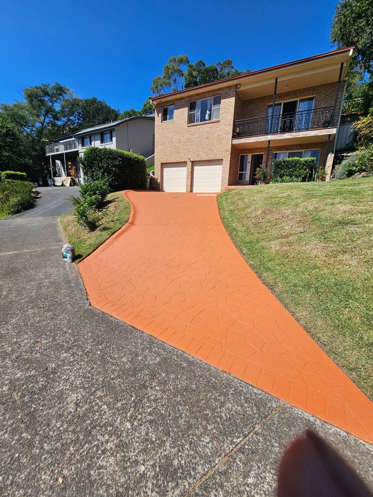 A large house with a driveway leading to it.