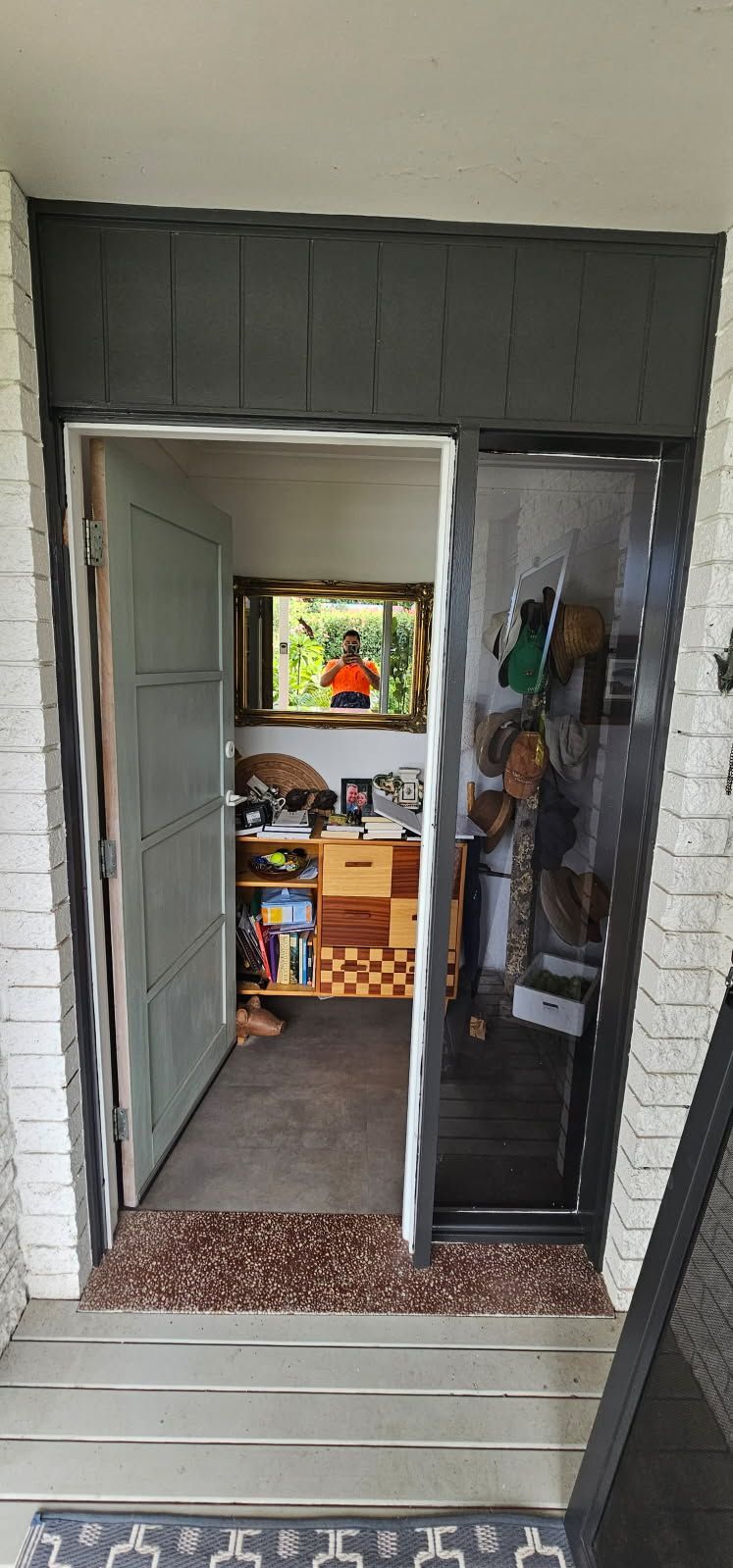 A doorway leading into a room with a window.