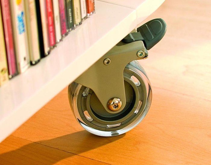 A close up of a wheel on a bookshelf
