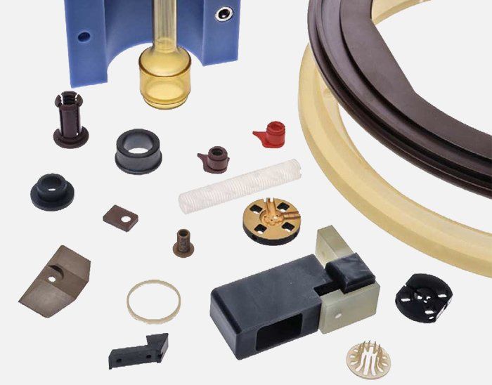 A bunch of different types of plastic parts on a white surface