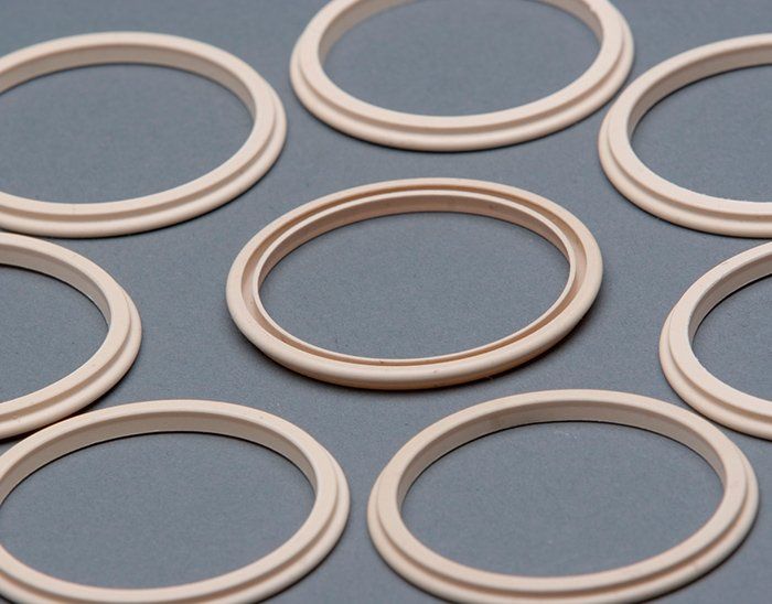 A group of rubber rings on a gray surface