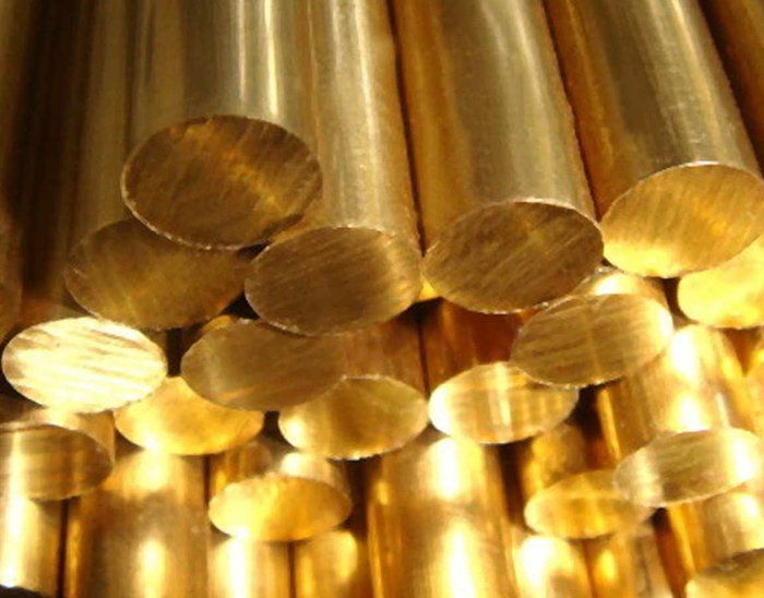 A bunch of brass rods are stacked on top of each other