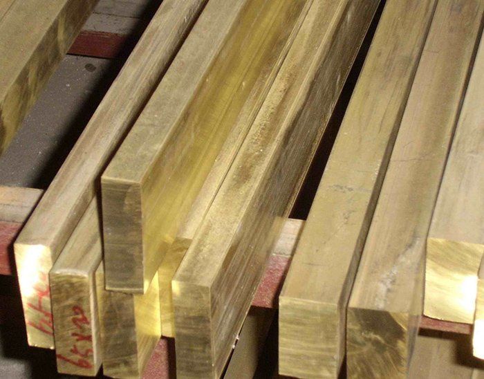 A stack of brass bars with the numbers ky29 on them