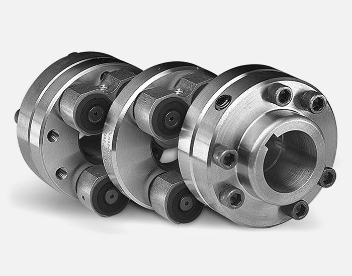 A close up of three pieces of metal on a white surface. Power Transmission