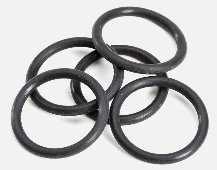A bunch of black rubber rings are stacked on top of each other