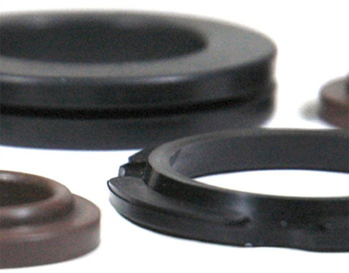 A group of rubber rings on a white surface