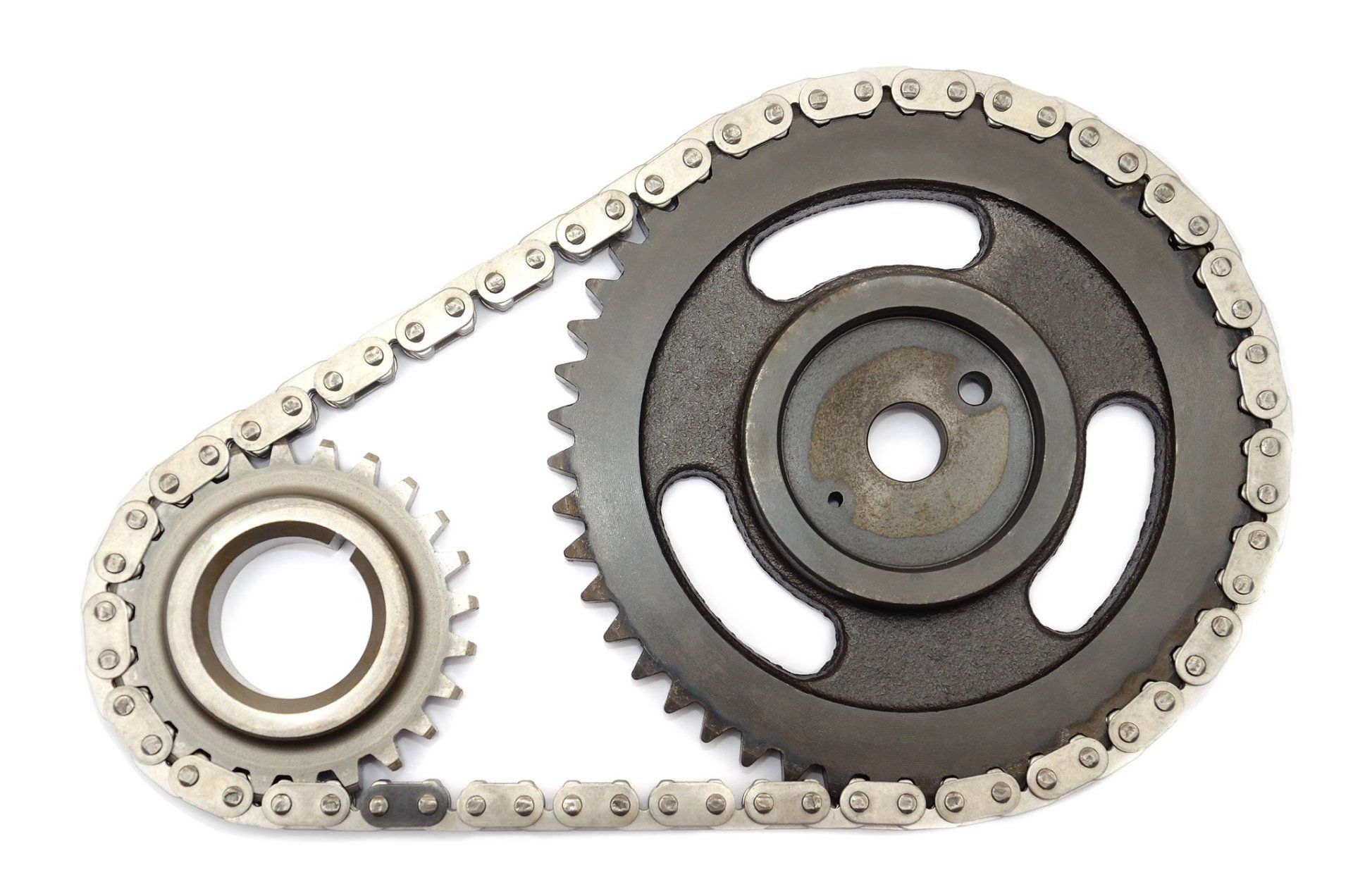 A close up of a chain and gear on a white background. Power Transmission