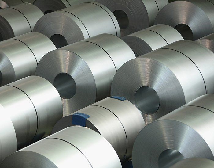 A bunch of metal rolls stacked on top of each other