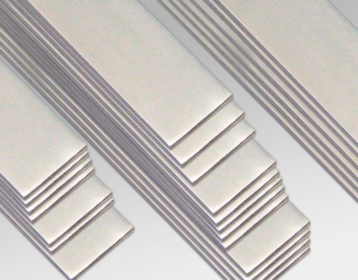 A close up of a stack of stainless steel bars