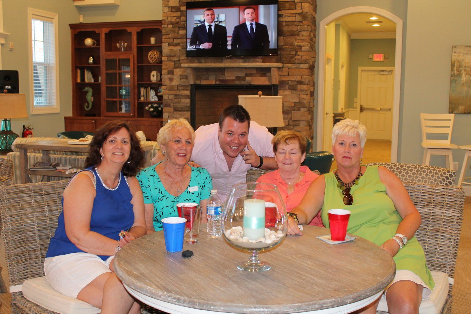 People Sitting at a table and smiling