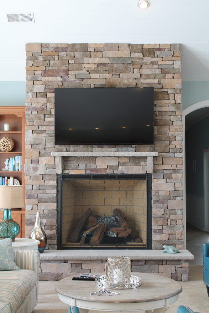 indoor fireplace with tv and seating