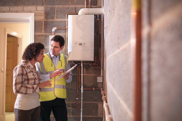 workers inspecting boilers