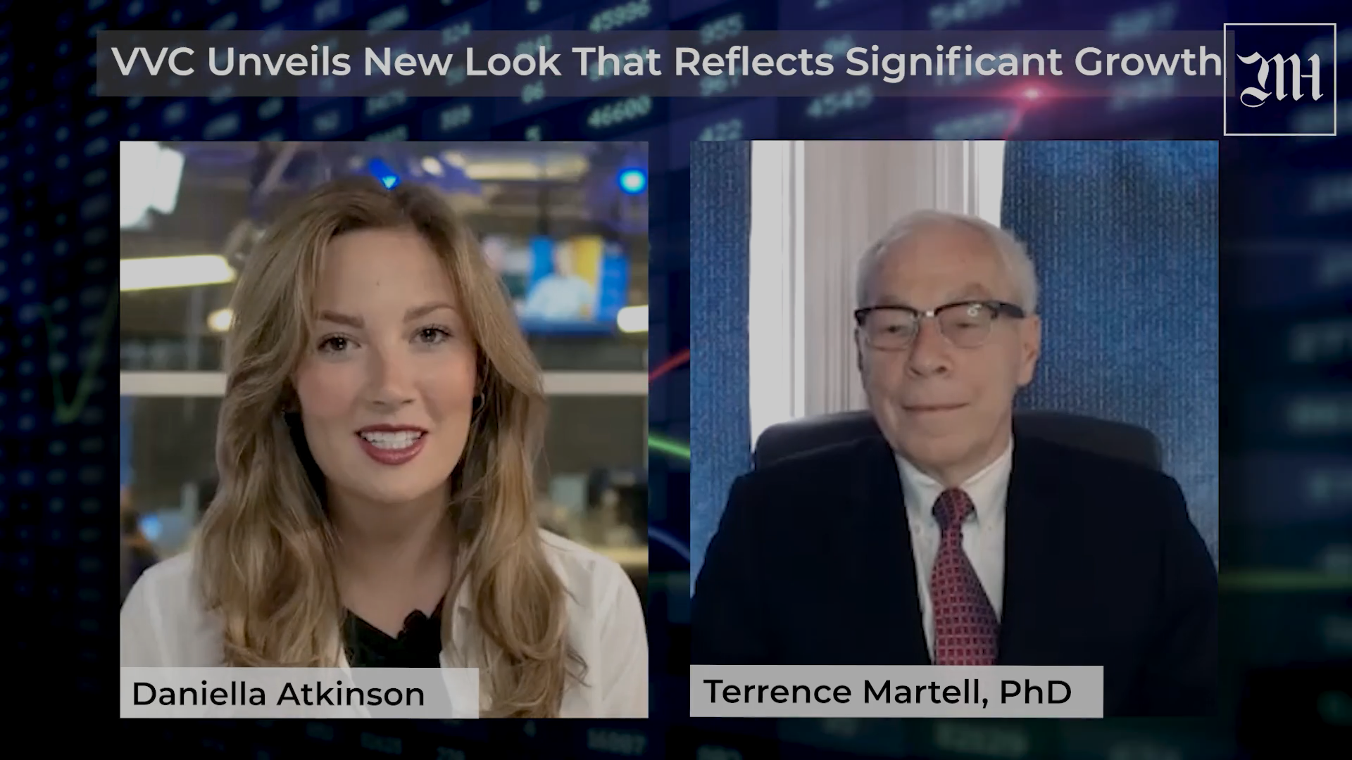 Terry Martell and a woman are sitting next to each other on a television screen for an interview.