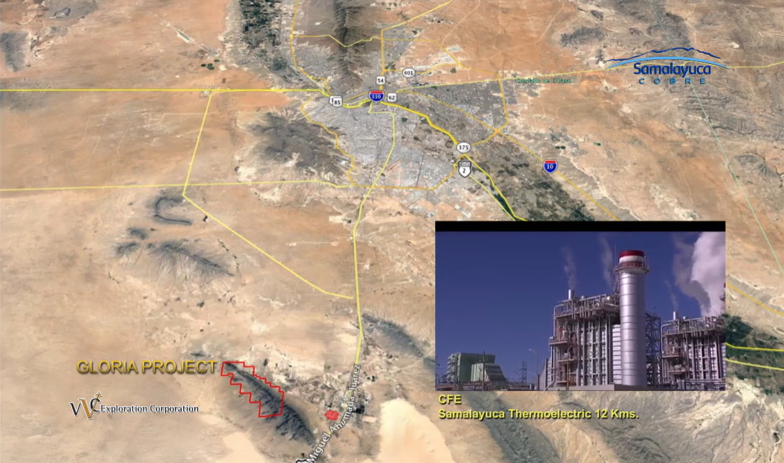 An aerial view of a city and a factory in the desert