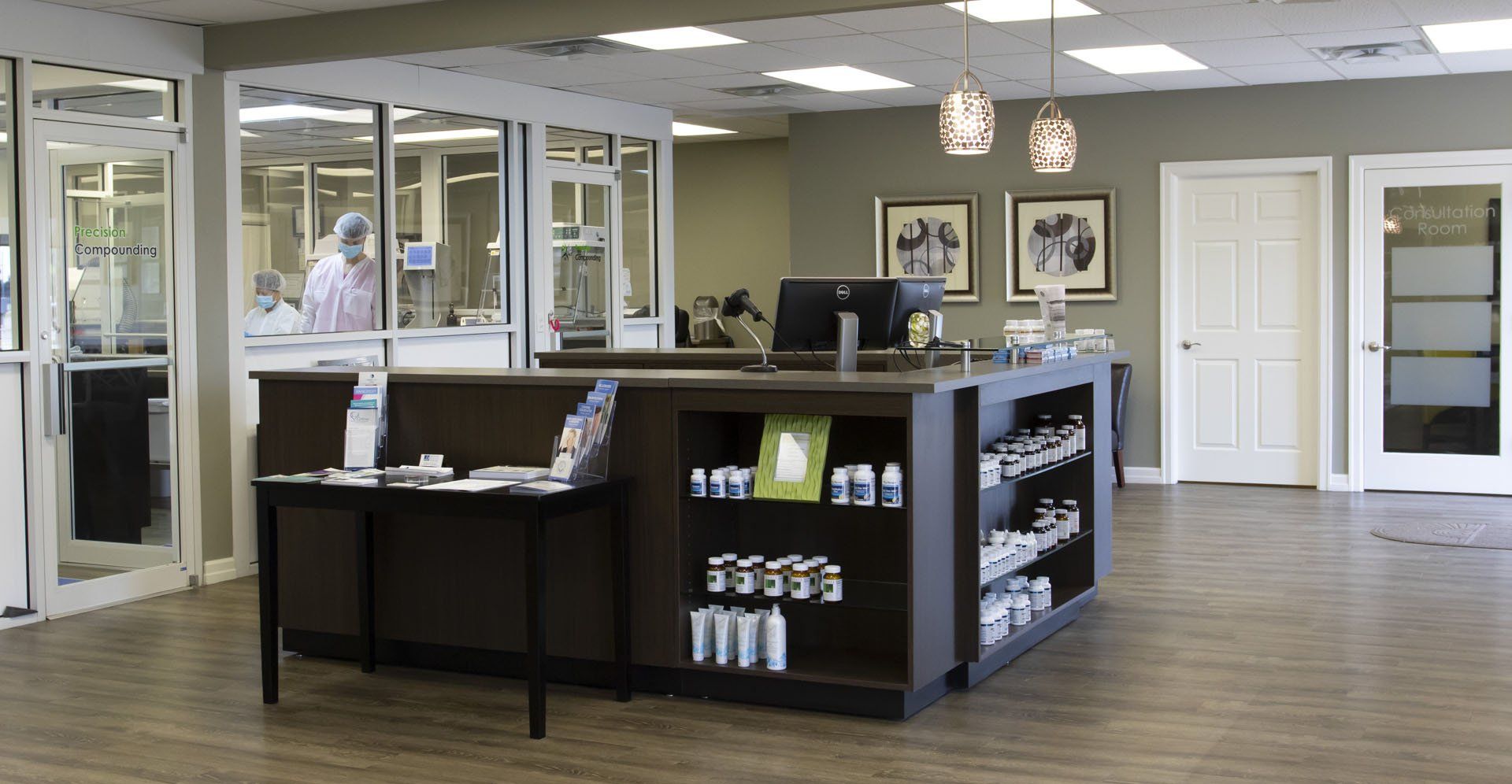 A reception area in a building with a desk and shelves