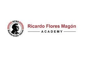 The logo for ricardo flores magon academy has a picture of a man in a circle.