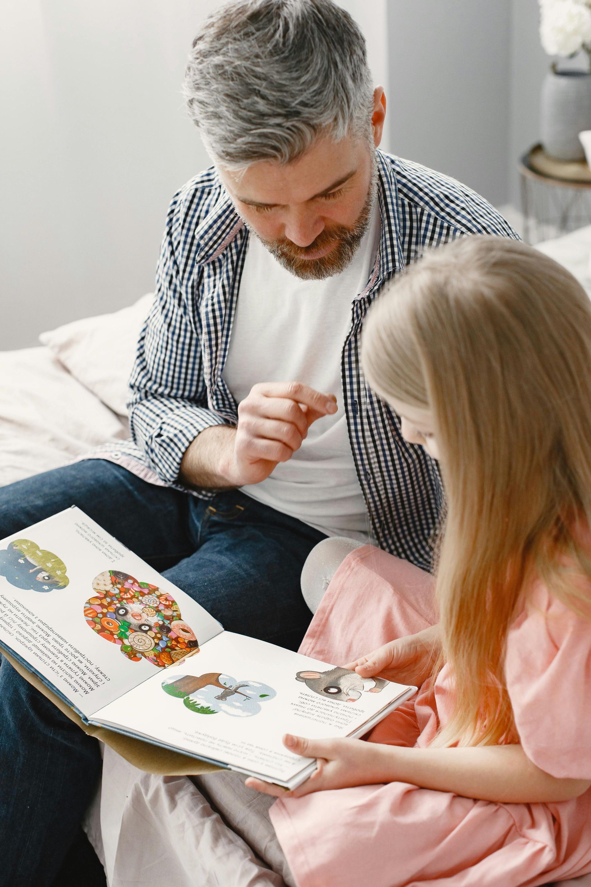 Father dressed nicely telling a story to his attentive child, illustrating the power of storytelling